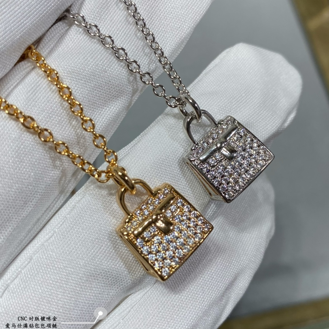hermès fully Di*m*nd-encrusted bag necklace